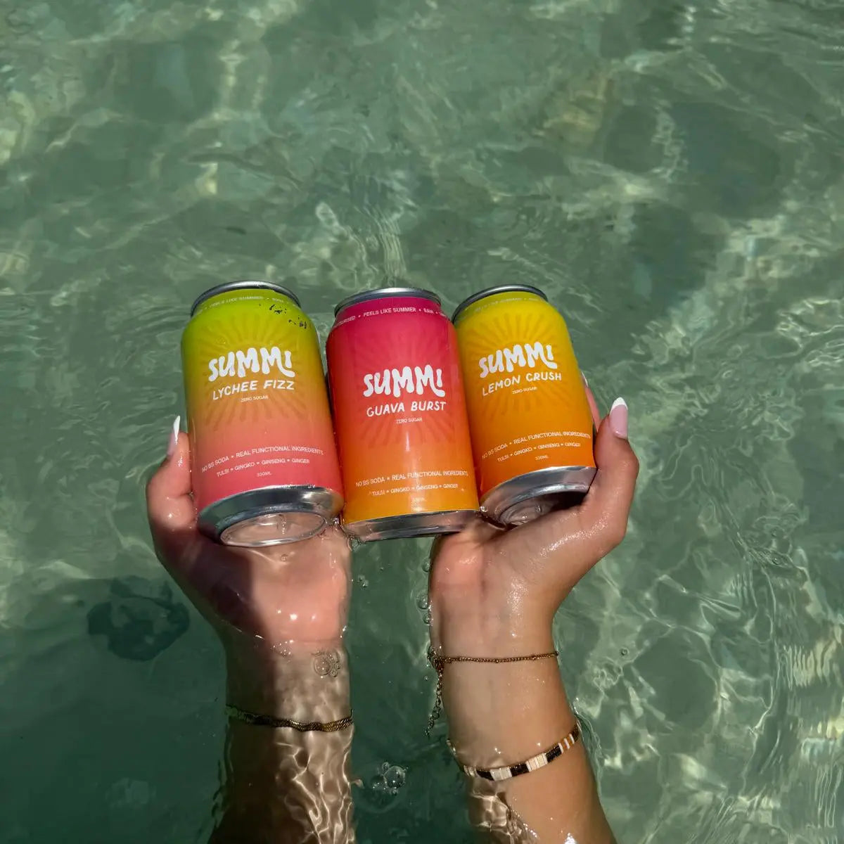 Handheld SUMMi Soda Cans